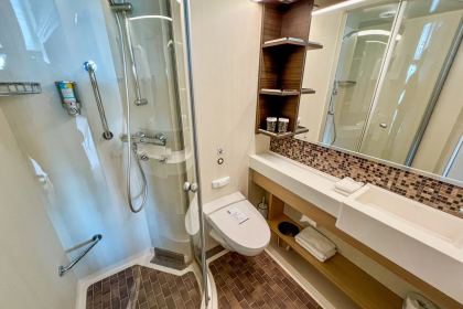 The bathroom, with the shower cubicle to the right of the basin.