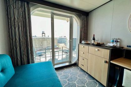 The seating area and the balcony door, with the sofa that converts for a third guest.